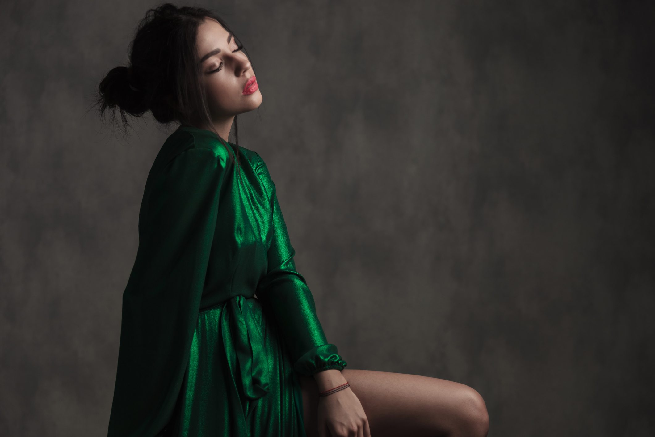 Elegant woman wearing a flowing green gown