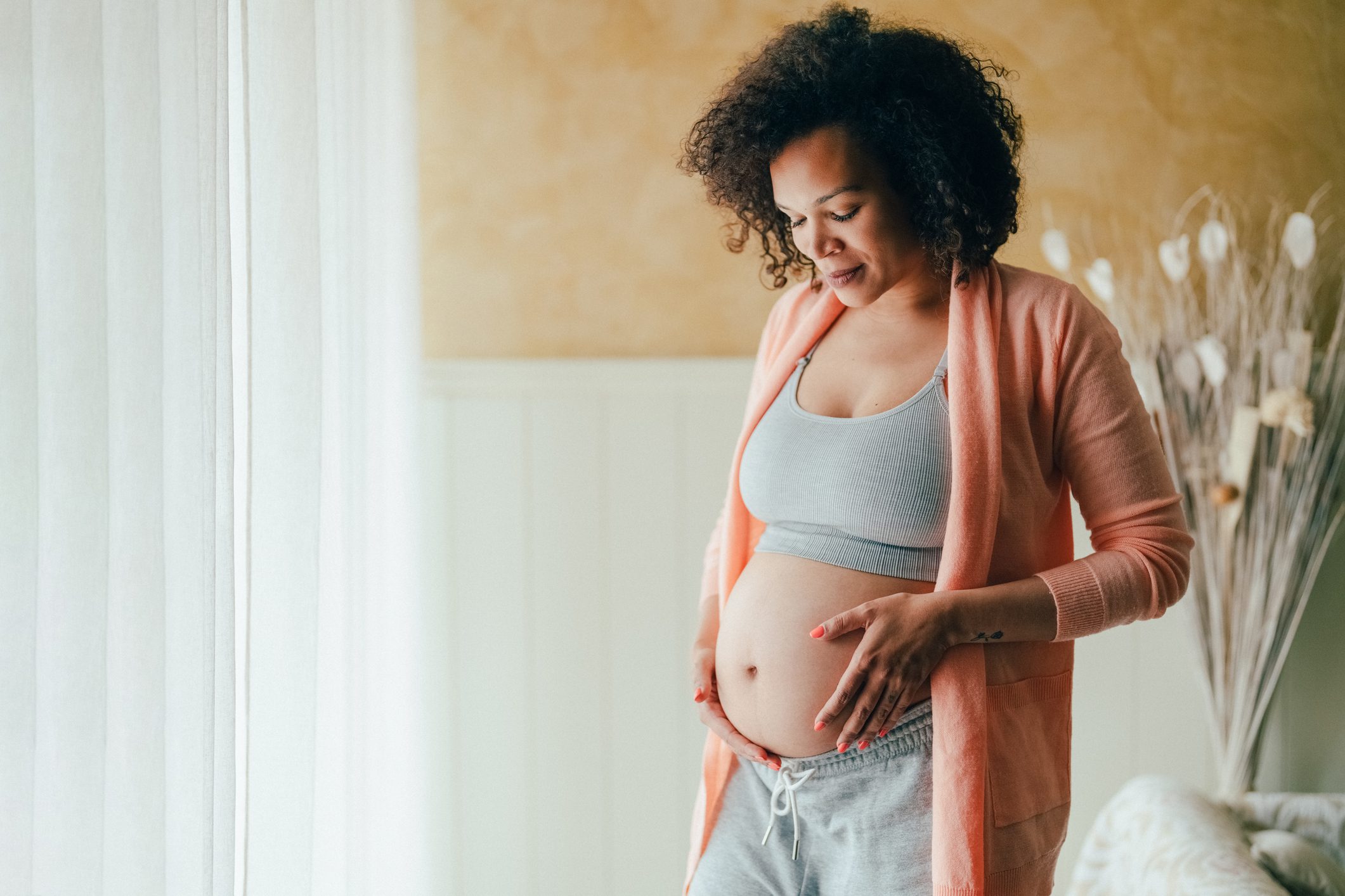 Expectant mother in cozy home setting