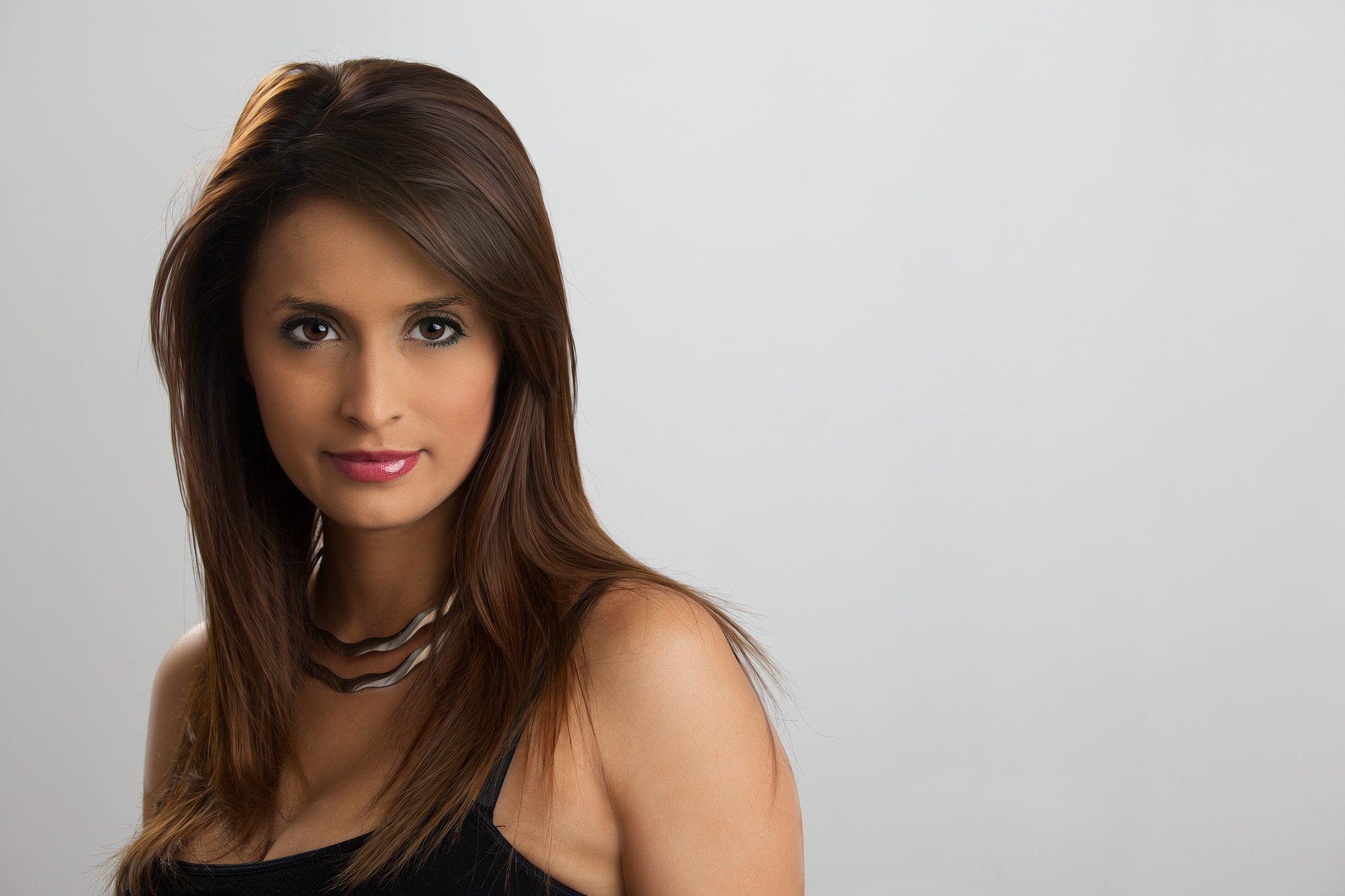 Woman with long brown hair posing