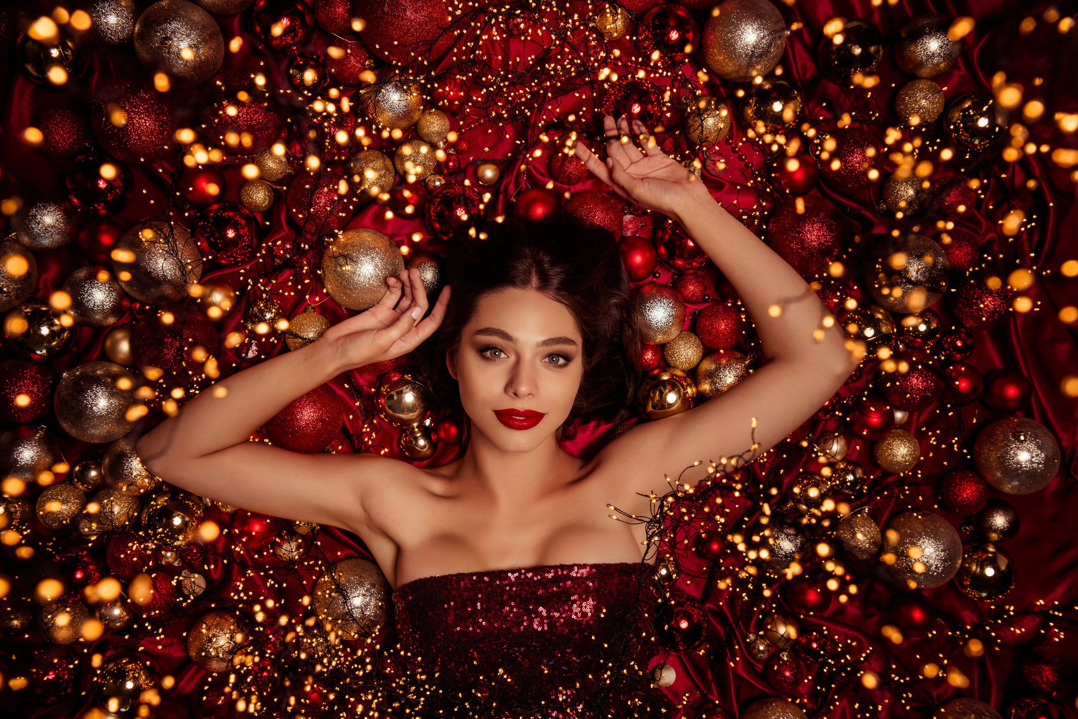 Glamorous woman in sparkling holiday scene