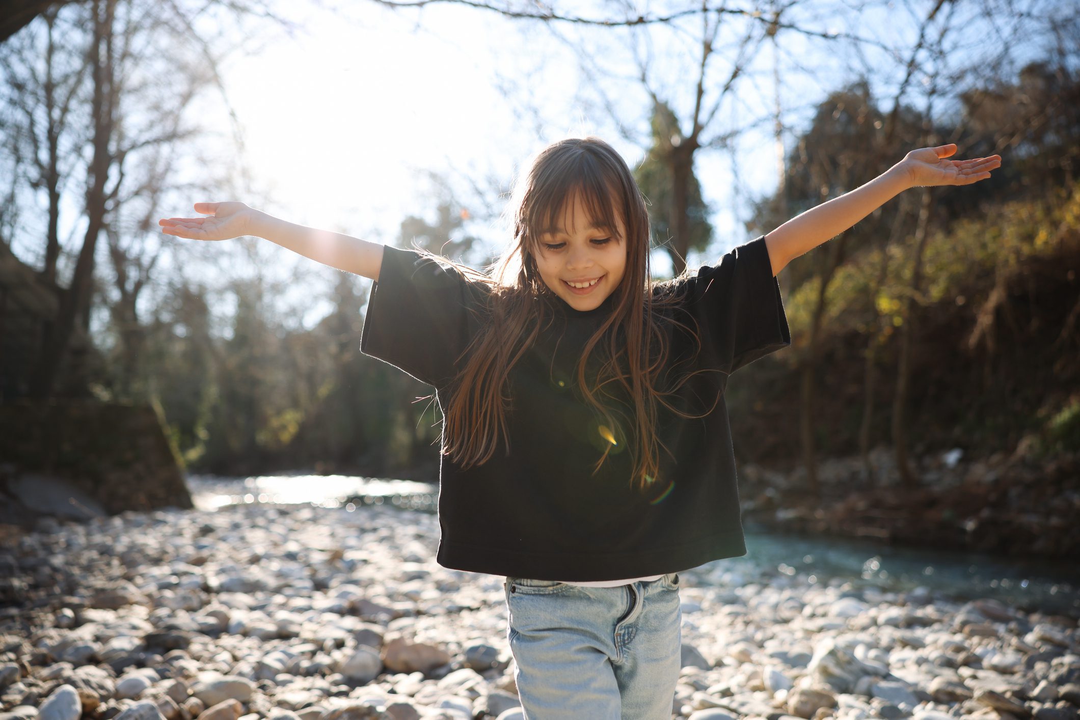 Smiling child enjoying nature outdoors