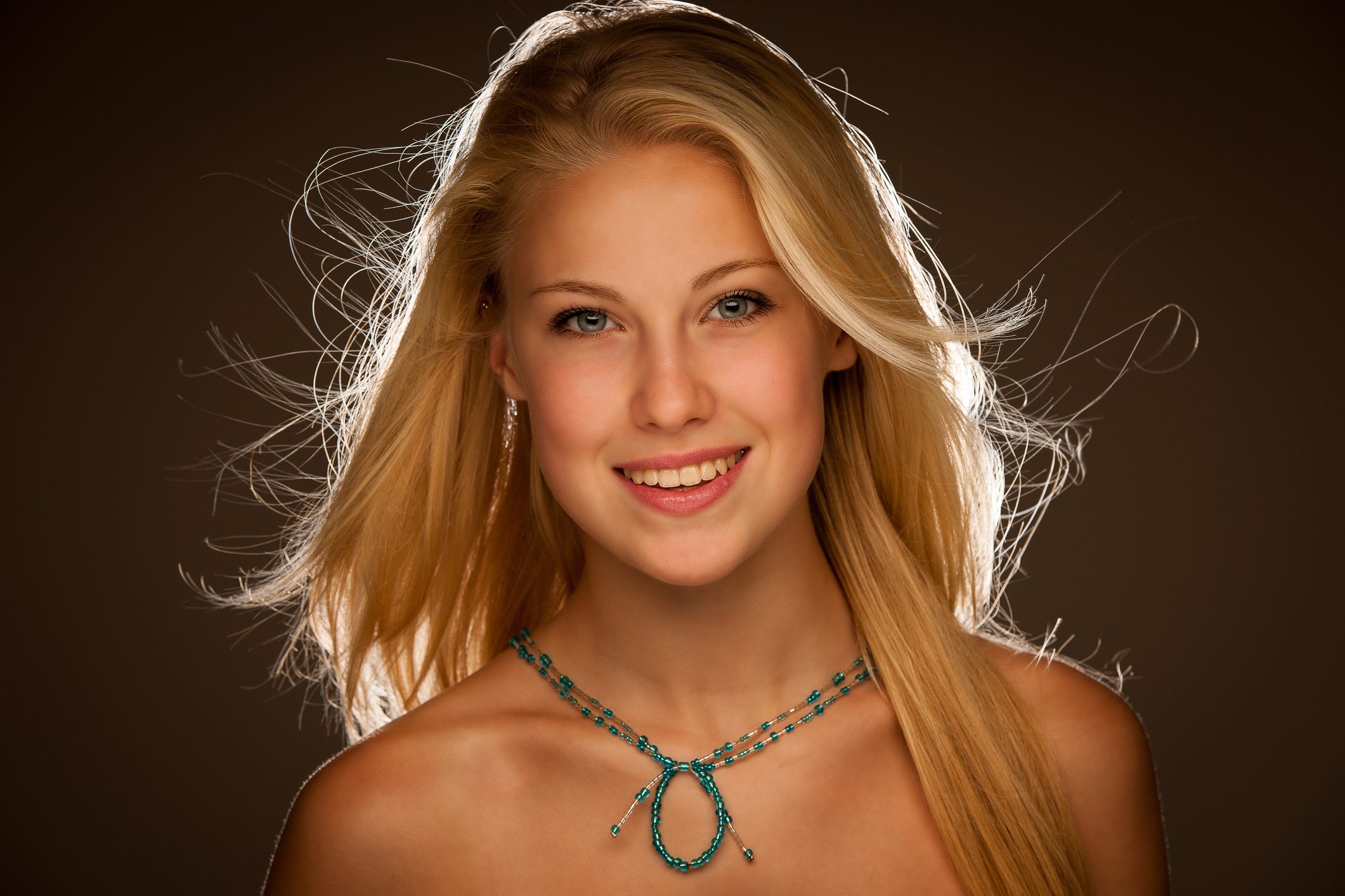 Smiling woman with long blonde hair