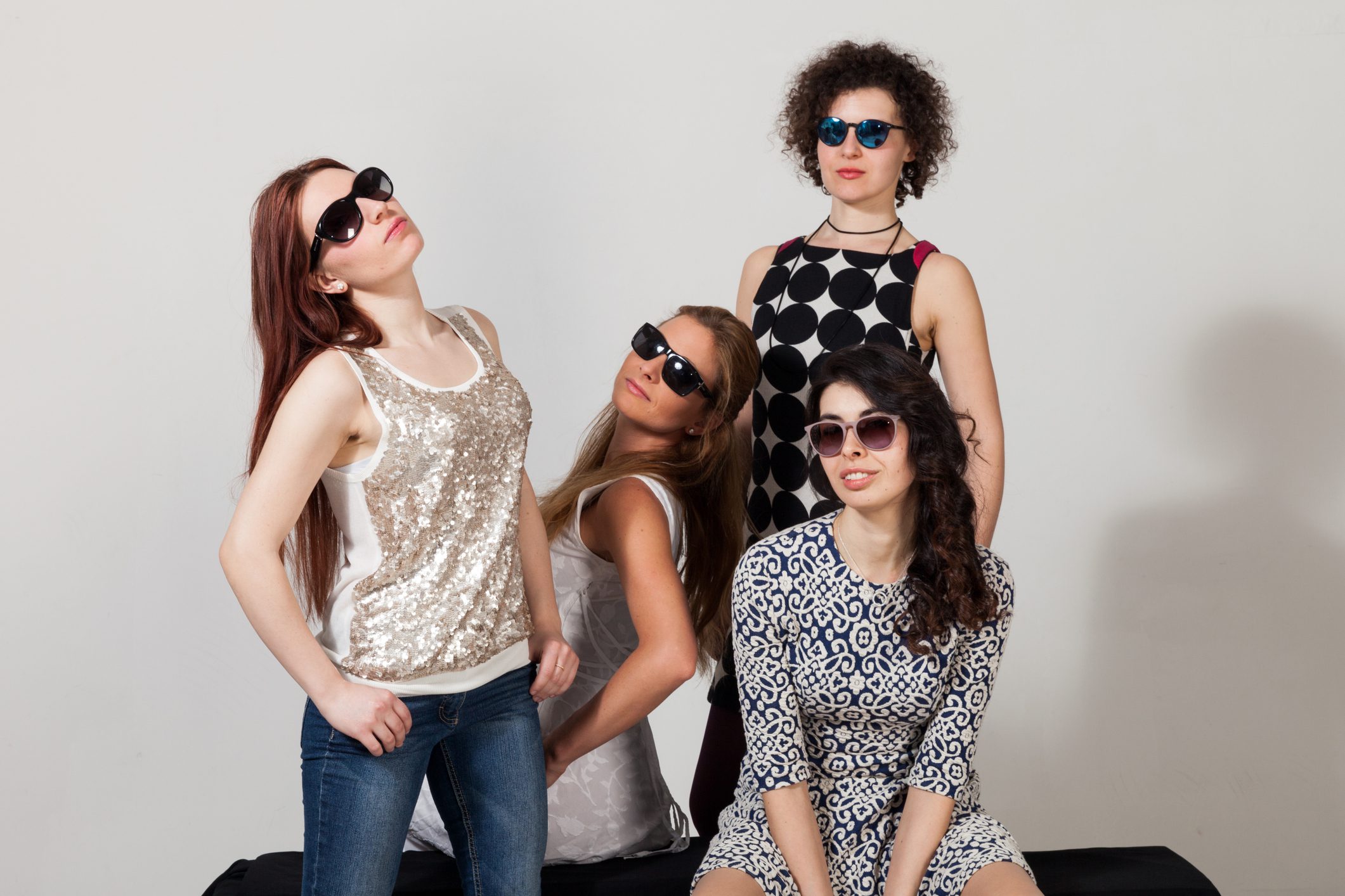 Fashionable friends striking a pose together