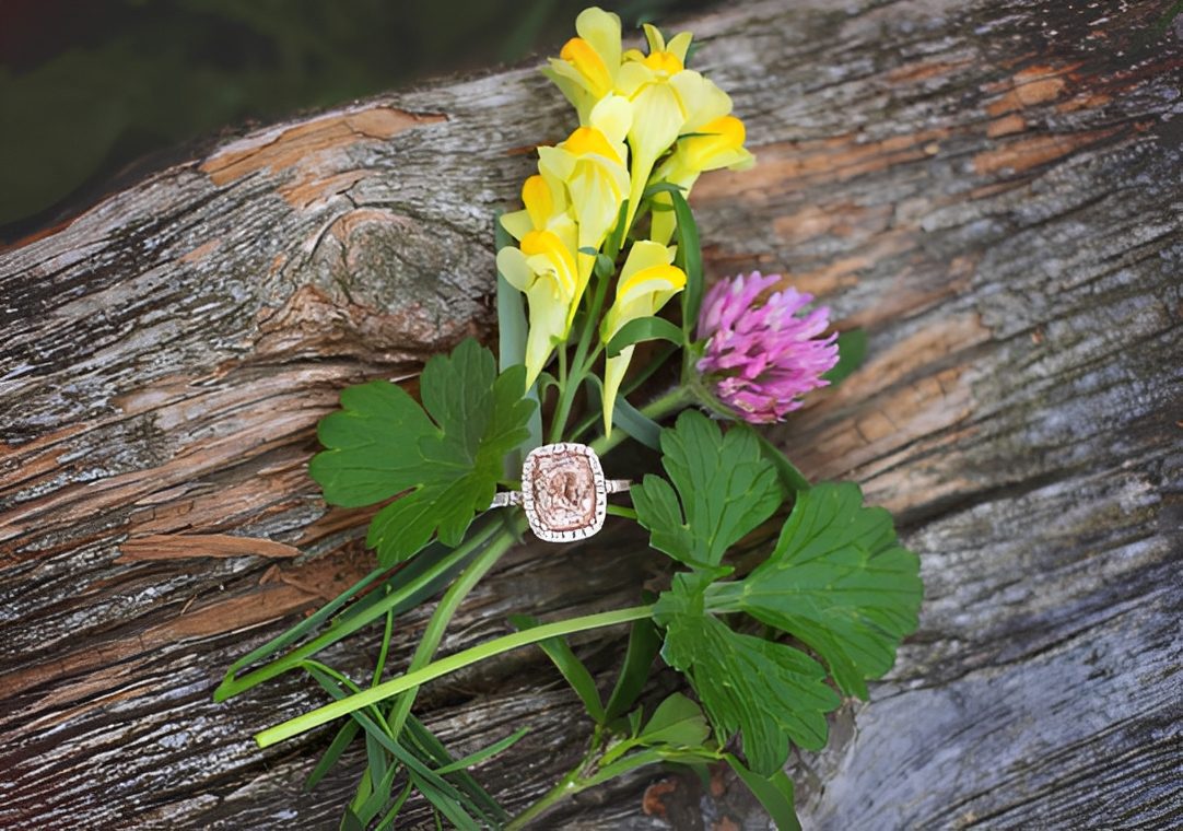 Ring and wildflowers on weathered log