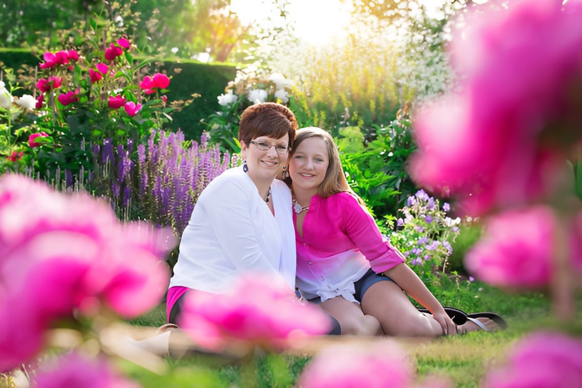 Family moment in vibrant garden setting